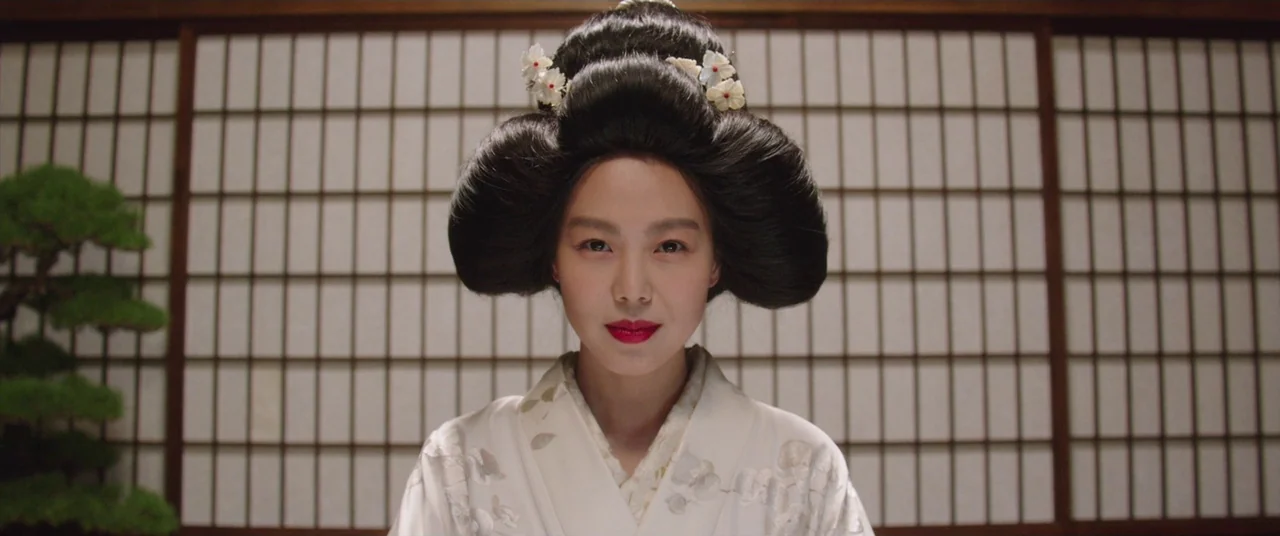 The Handmaiden (2016) movie still: medium — A traditional Japanese room features a grid-patterned shoji screen and a small bonsai tree. A young…