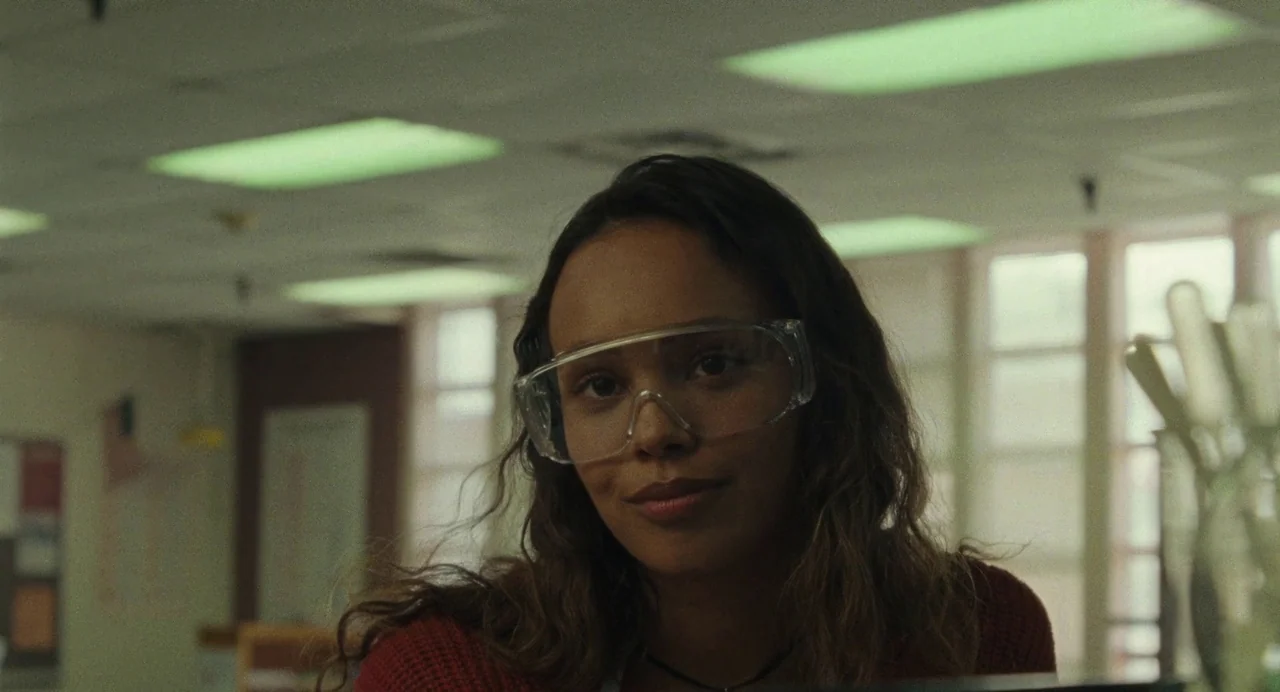 When You Finish Saving The World (2022) movie still: closeup — A high school or university science laboratory has tiled ceilings and overhead…