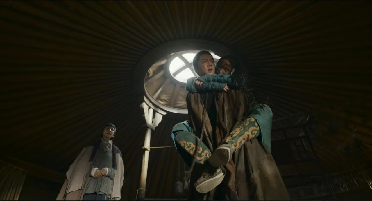 Legends of the Condor Heroes: The Gallants (2025) movie still: fullbody — The interior of a circular wooden structure features a prominent overhead…