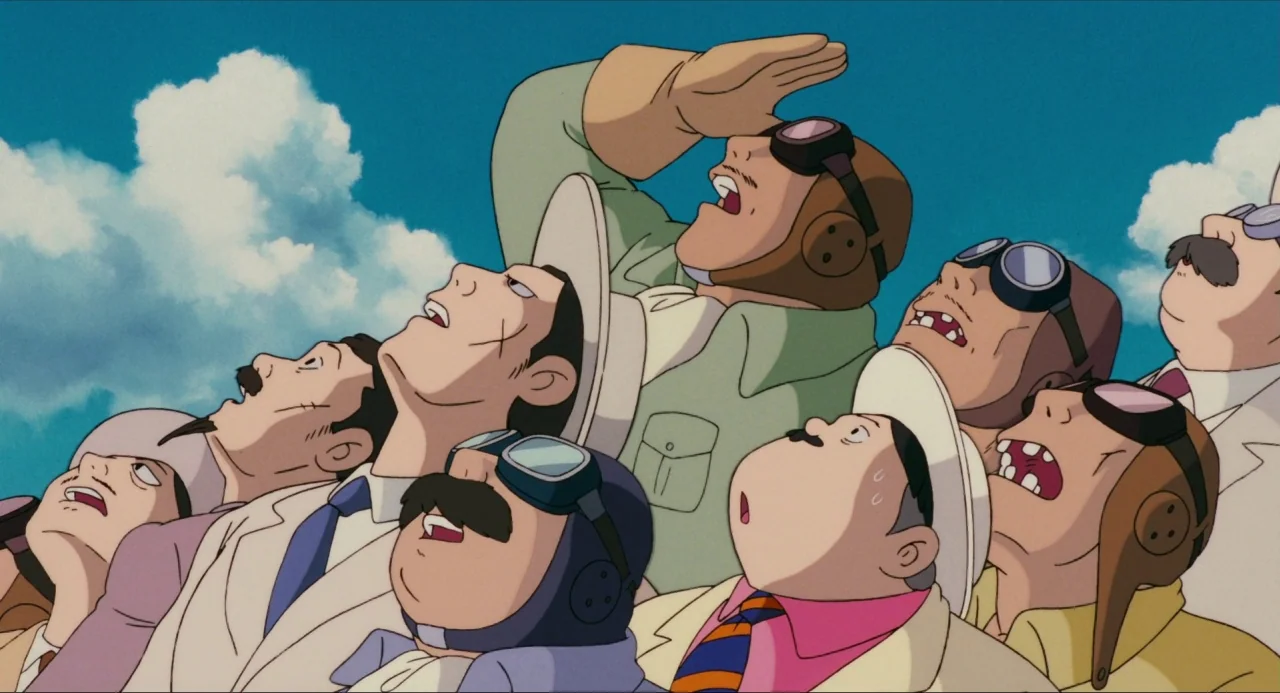Porco Rosso (1992) movie still: medium — A group of aviators in period attire stare upwards at the clear blue sky. Bright white clouds drift in the…