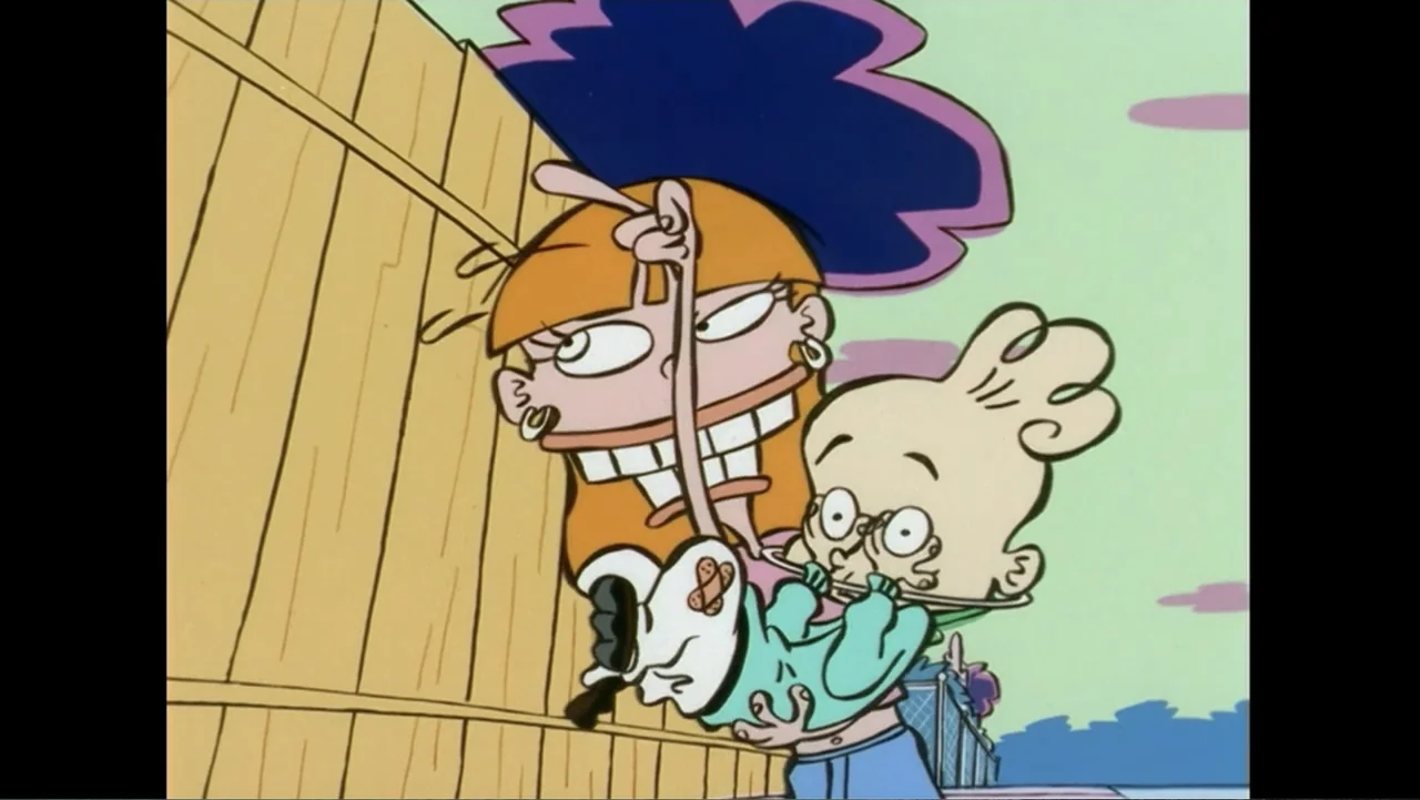 Cartoon Network: Animated Through the Years (2022) movie still: medium — An outdoor area beside a wooden fence against a simple light green…