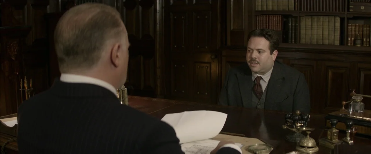 Fantastic Beasts and Where to Find Them (2016) movie still: medium — A wood-paneled office contains a heavy desk with documents and metal office…