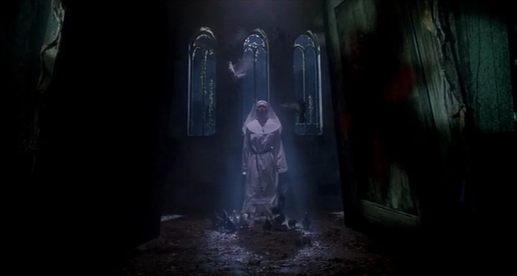 A Nightmare On Elm Street 5: The Dream Child (1989) movie still: fullbody — A dimly lit, stone-floored interior space features three tall, arched…