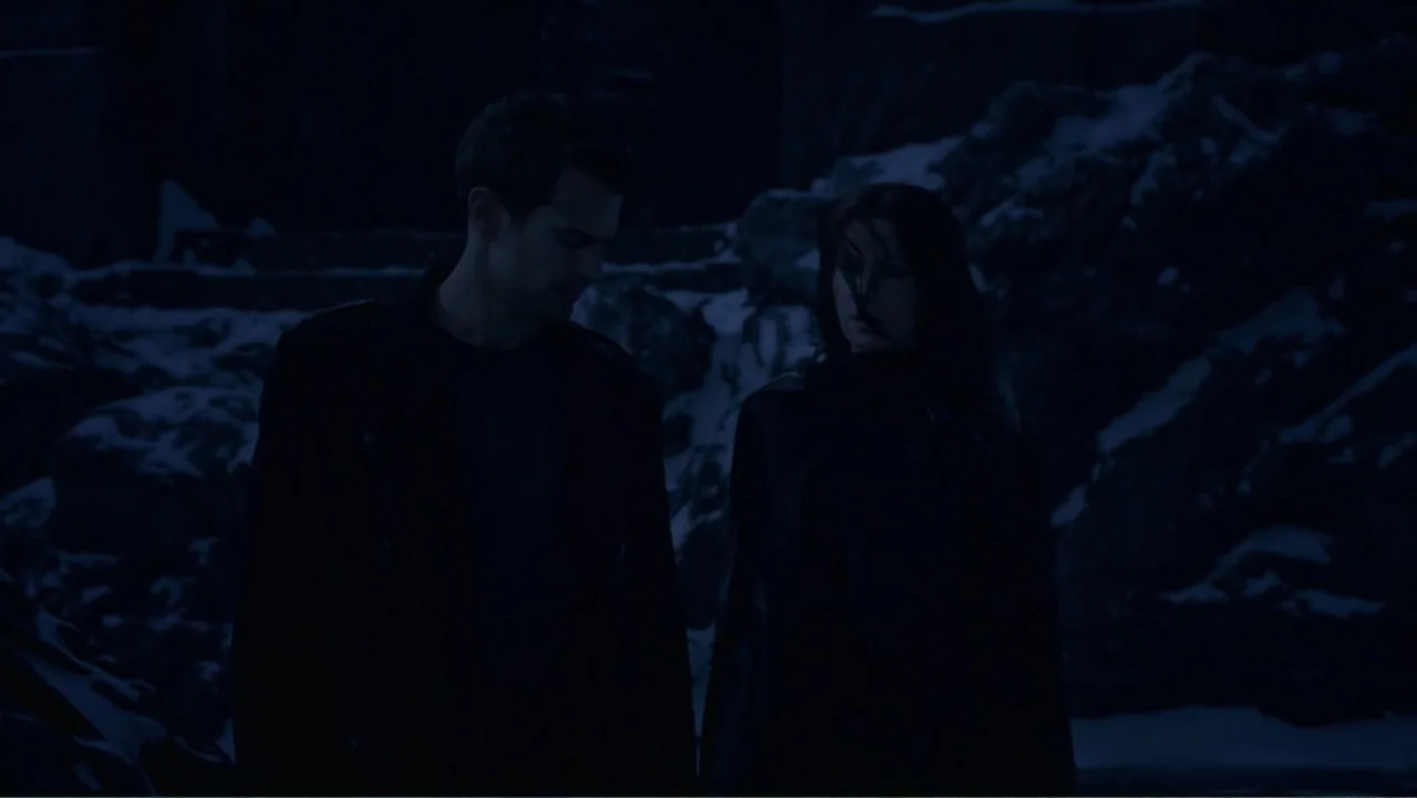 Underworld: Blood Wars (2016) movie still: medium — A dark, snow-dusted rocky environment at night with rugged terrain in the background. A man and…