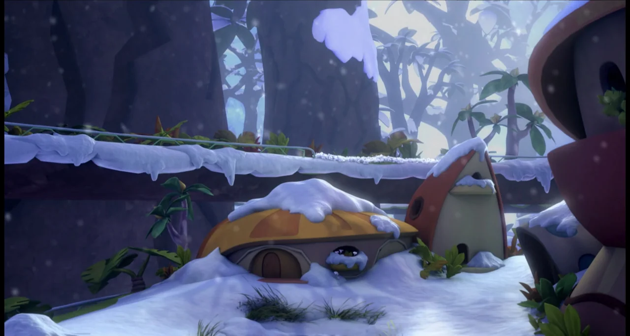 The Wishmas Tree (2020) movie still: wide — A miniature village with stylized, rounded buildings is covered in a fresh layer of snow. Light snow…