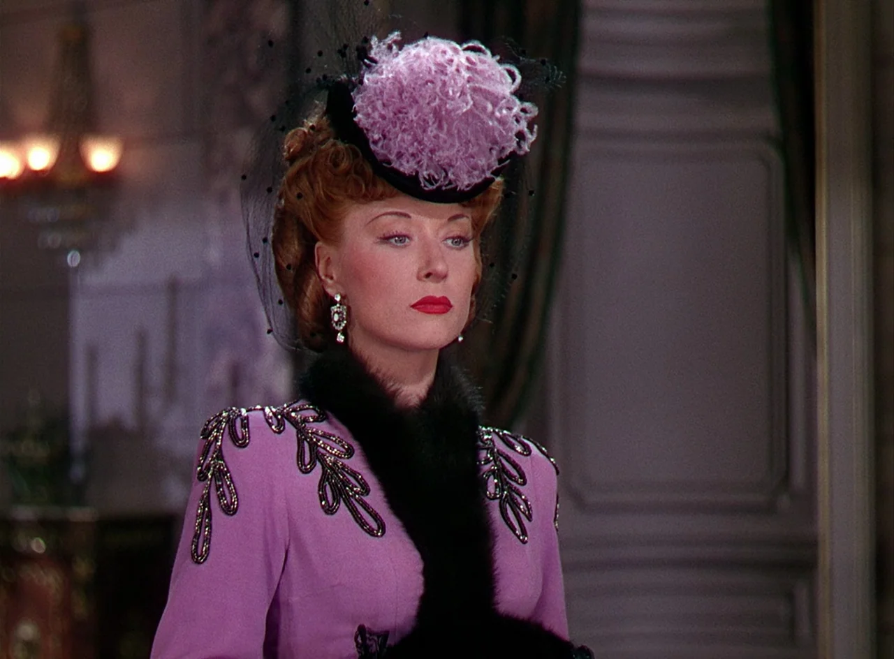 Phantom of the Opera (1943) movie still: medium — A lavish indoor setting with ornamental wall paneling and a soft glowing chandelier background. A…