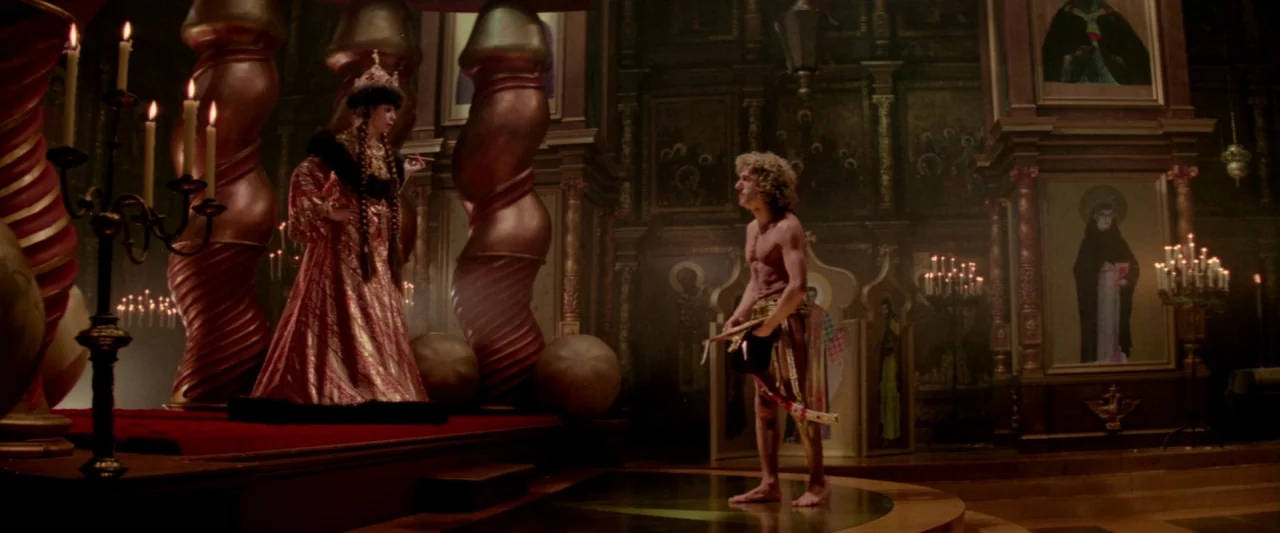 Lisztomania (1975) movie still: wide — A lavishly decorated cathedral interior features large ornate columns and religious portraits on walls. A…