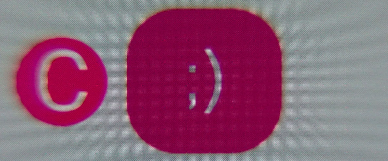 Promising Young Woman (2020) movie still: closeup — A close up view of a digital display showing stylized magenta graphical symbols. The frame shows…