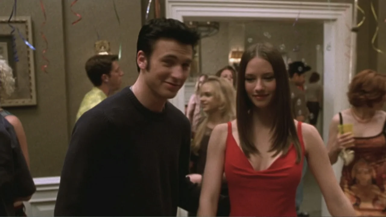 Not Another Teen Movie (2001) movie still: medium — A domestic interior with beige walls, decorative molding, and party streamers visible in…