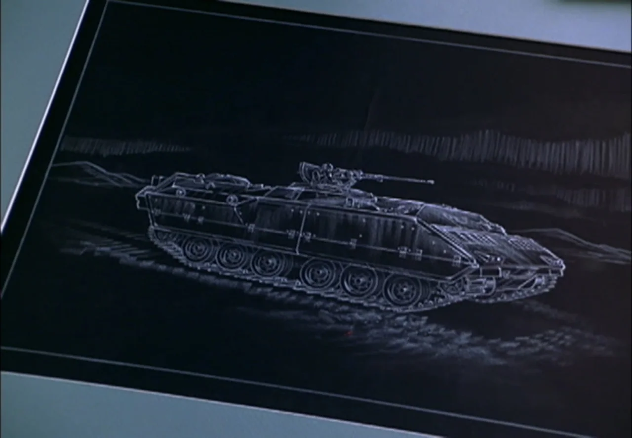 The Pentagon Wars (1998) movie still: closeup — A flat digital screen displays a white line drawing of a military tank. The tank is positioned in…
