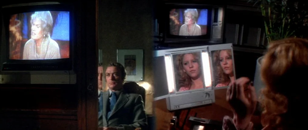Dressed to Kill (1980) movie still: medium — A dimly lit room contains a vanity table with a tri-fold makeup mirror. A person sits at the table,…