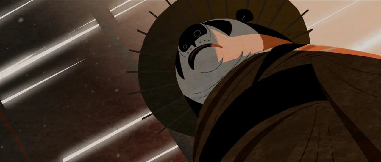 Kung Fu Panda (2008) movie still: closeup — A stylized panda stands against a dark background with white motion lines visible. The character wears a…