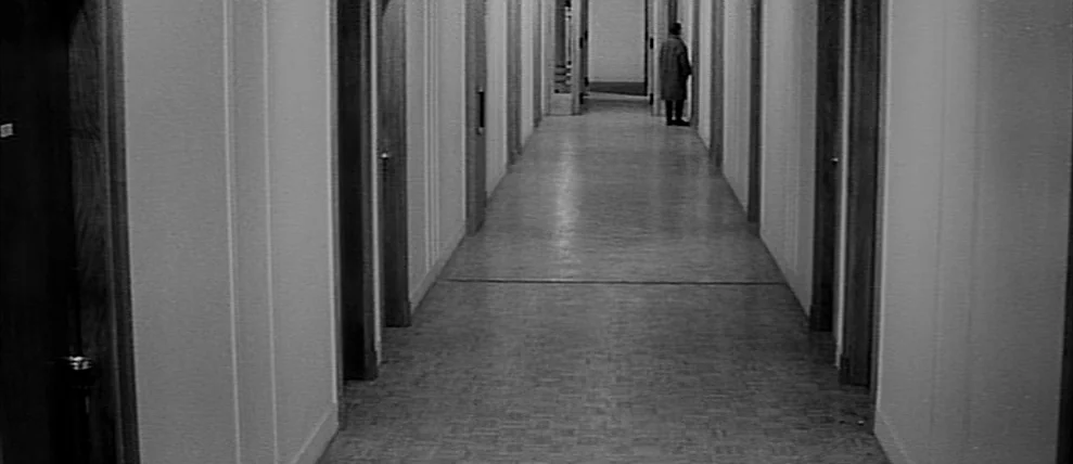 Shoot The Piano Player (Tirez Sur Le Pianiste) (1960) movie still: wide — A long, symmetrical hospital corridor features stark white walls and…