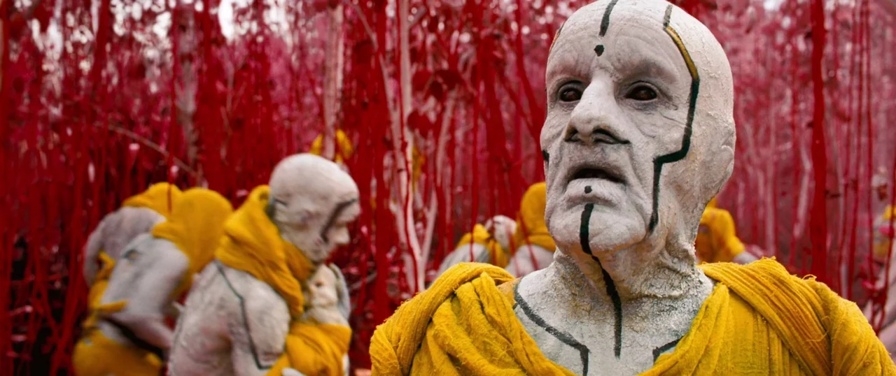 Star Trek Into Darkness (2013) movie still: medium — A surreal landscape features dense, bright red vertical plant stalks and white-skinned figures.…