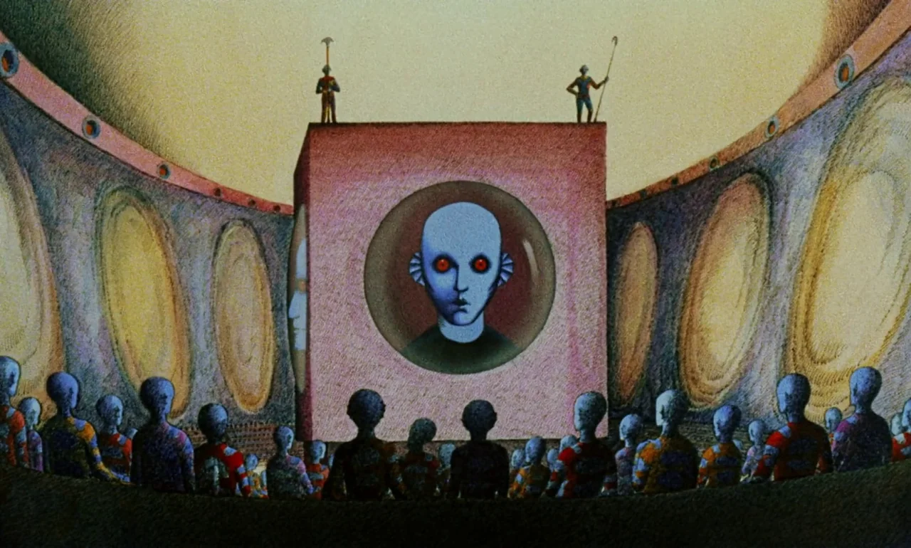 Fantastic Planet (1973) movie still: wide — A curved auditorium with walls resembling organic, ribbed structures surrounds a central cube monolith.…