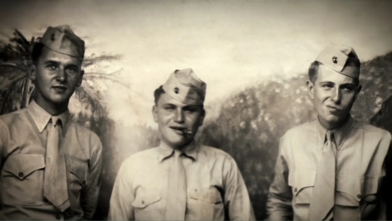 Wartorn: 1861-2010 (2010) movie still: medium — A studio portrait shows three young men posing in front of a painted tropical backdrop. The soldiers…
