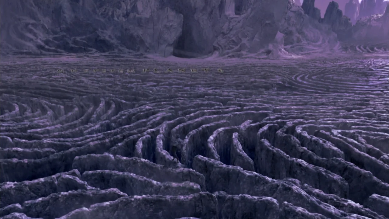 The Chronicles of Riddick (2004) movie still: establishing — A vast, desolate alien surface covered in intricate, spiraling stone canyons and…