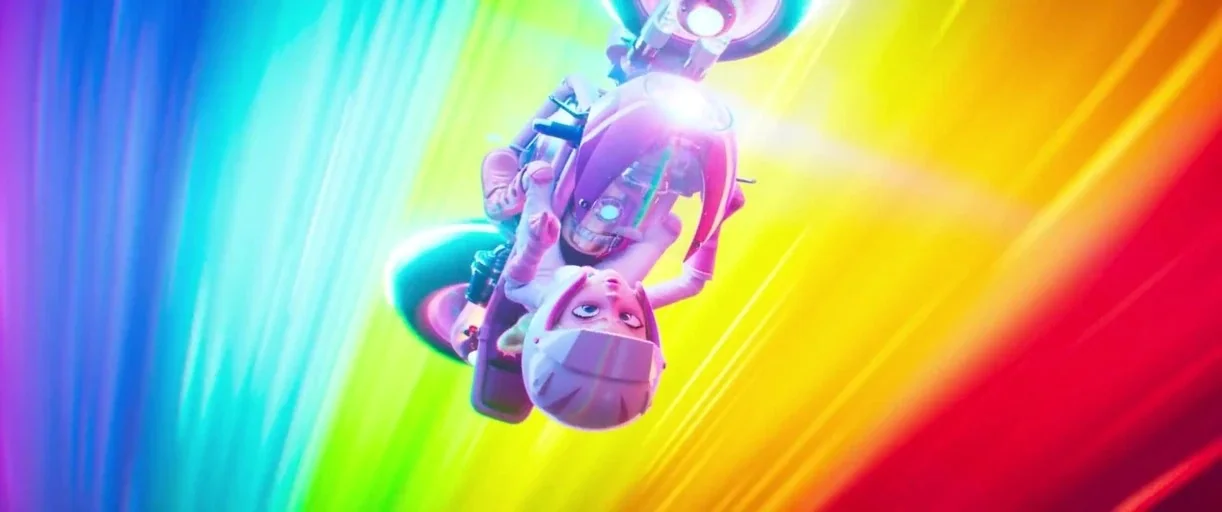 The Super Mario Bros. Movie (2023) movie still: fullbody — A character rides a futuristic motorcycle through a vibrant, blurred rainbow-colored…
