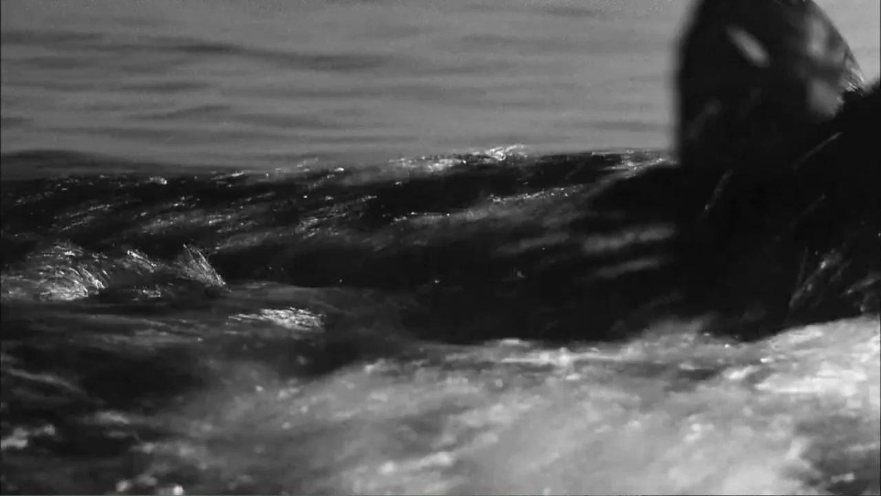 Serial Killer: Red Sea Attacks (2023) movie still: wide — The frame shows dark, churning water with visible wave crests and foam. The water ripples…