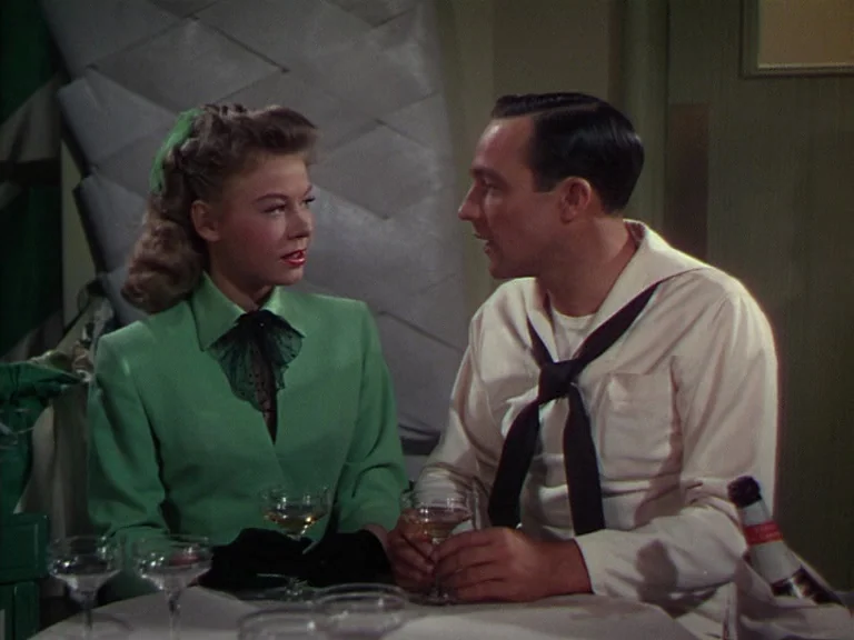 On The Town (1949) movie still: medium — A booth in a restaurant setting with white tablecloths and multiple cocktail glasses visible. A blonde…