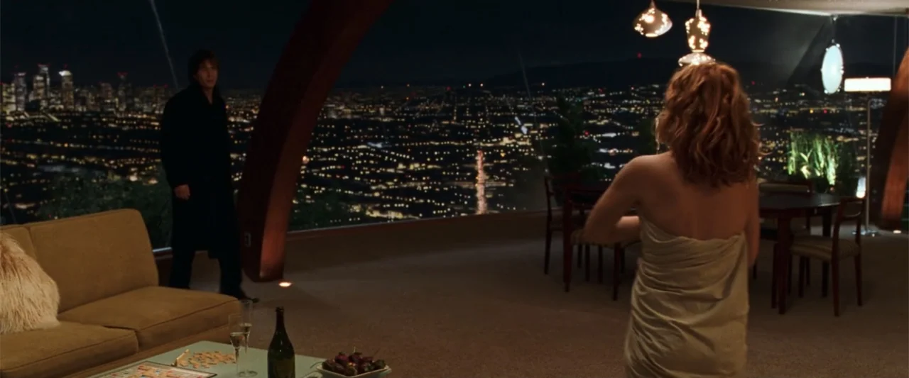 Charlie's Angels (2000) movie still: wide — A modern luxury apartment features curved wooden ceiling beams and floor-to-ceiling glass windows at…