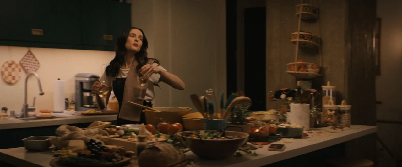 Something from Tiffany's (2022) movie still: medium — A well-lit contemporary kitchen counter is filled with bowls of vegetables and cooking…