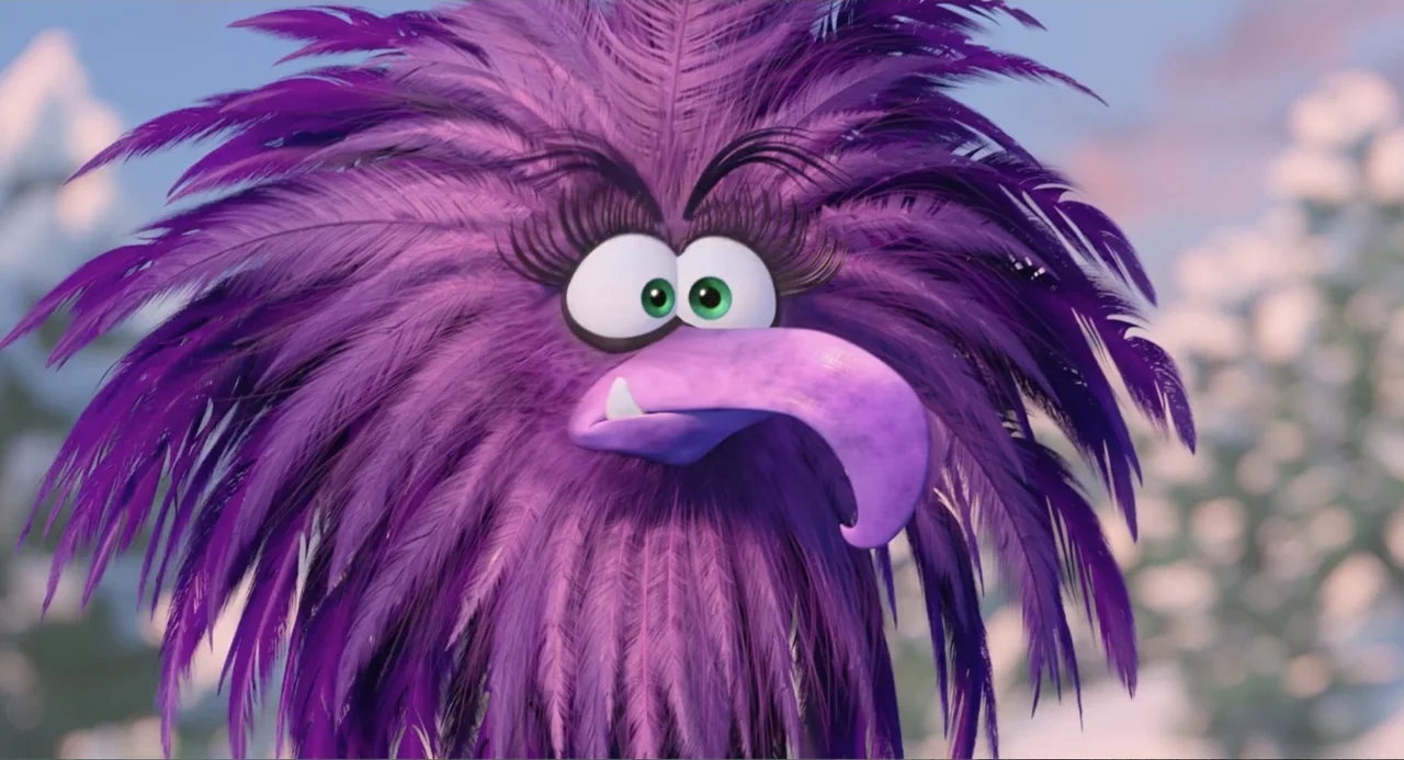 The Angry Birds Movie 2 (2019) movie still: closeup — A close-up shot of a purple, feathered bird character against a blurred outdoor background.…