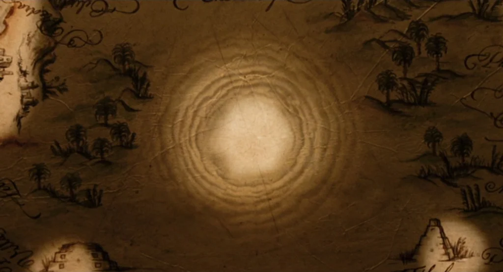The Fountain (2006) movie still: closeup — An aged paper map rests on a surface, featuring ink illustrations of palm trees. Circular beams of light…