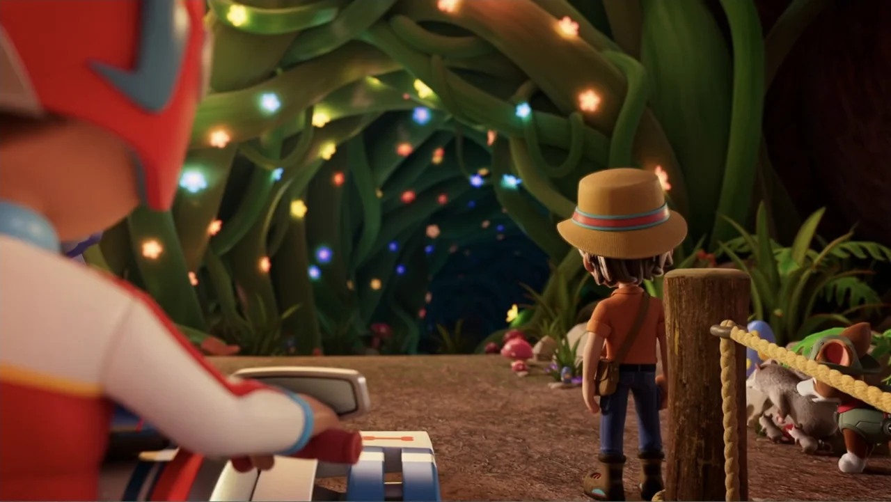 Valiente: A Tracker Story (2025) movie still: medium — A dark cave entrance is framed by thick twisting green vines lit with tiny glowing stars. A…