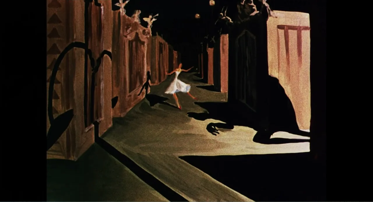 Made in England: The Films of Powell and Pressburger (2024) movie still: wide — A dark outdoor pathway is lined with tall, monolithic structures and…