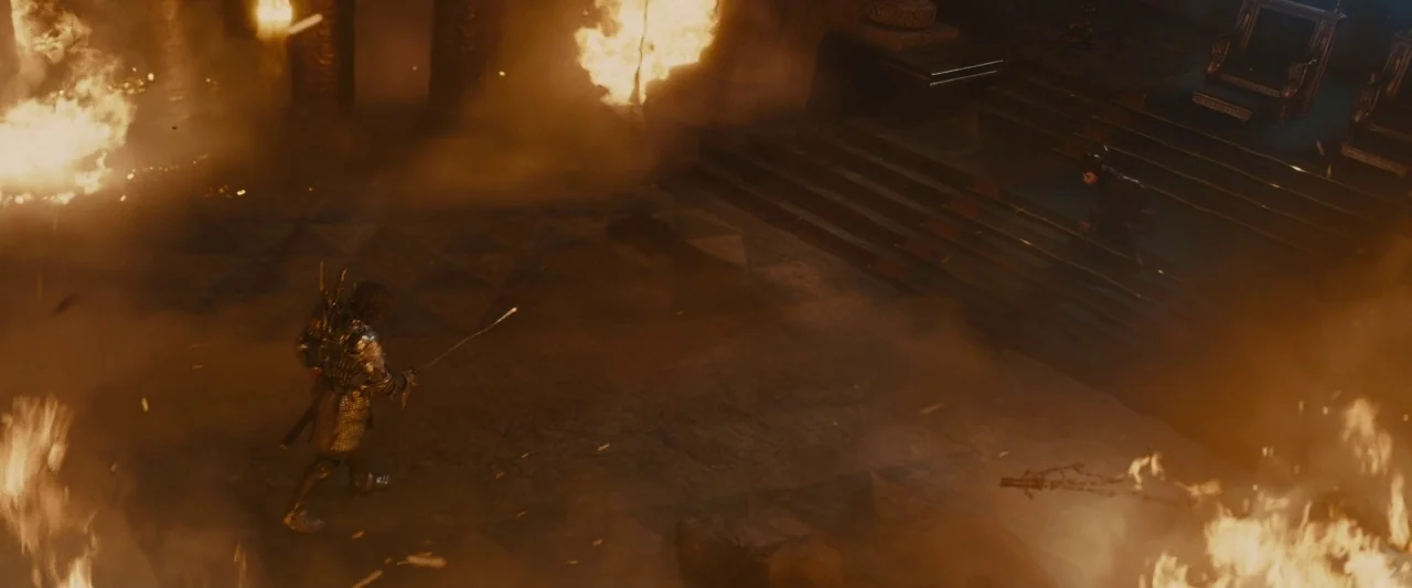 Maleficent (2014) movie still: wide — A stone chamber filled with fire and thick smoke obscures the architectural details. A knight advances toward…