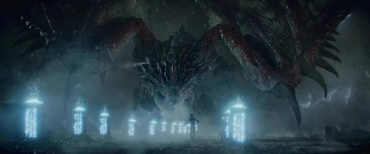 Monster Hunter (2020) movie still: wide — A dark, rain-swept landscape features rows of glowing, ancient stone monoliths. A small human figure…