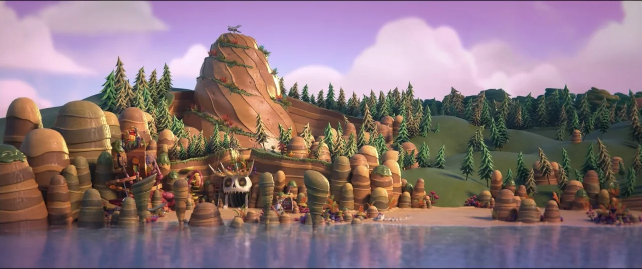 Scarygirl (2023) movie still: establishing — A fantastical landscape features stacked rounded rock formations and coniferous trees along a water…