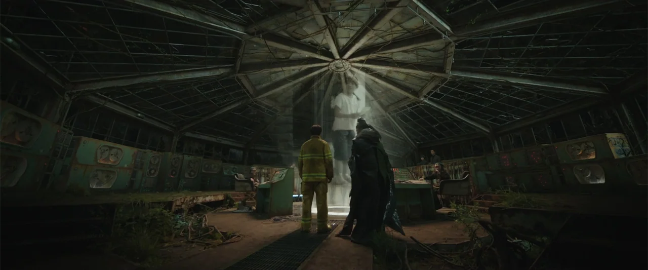 Along with the Gods: The Two Worlds (2017) movie still: wide — A dark, dilapidated circular room contains rusted consoles and overgrown greenery…