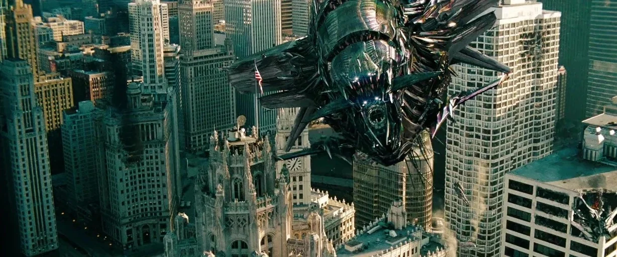 Transformers: Dark of the Moon (2011) movie still: wide — A dense urban landscape features tall skyscrapers surrounding a prominent Gothic-revival…