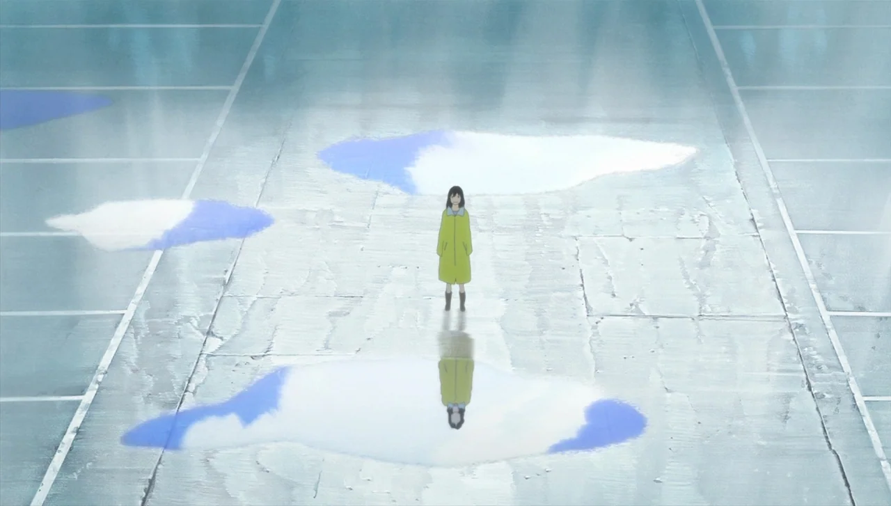 Wolf Children (2012) movie still: wide — A vast, wet concrete parking lot features several large puddles reflecting the cloudy sky. A young girl in…