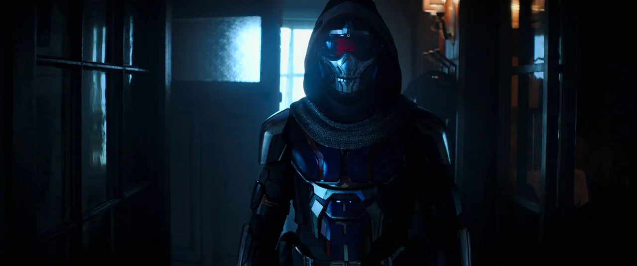 Black Widow (2021) movie still: medium — A dimly lit narrow hallway with a window at the end providing backlight. A armored figure wearing a skull…