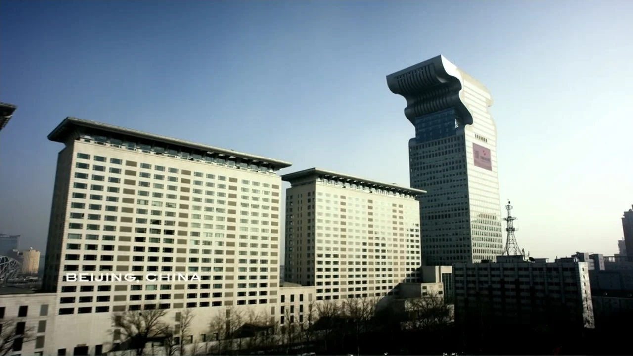 Transformers: Age of Extinction (2014) movie still: establishing — A view of the Pangu Plaza complex in Beijing featuring a distinctive skyscraper.…
