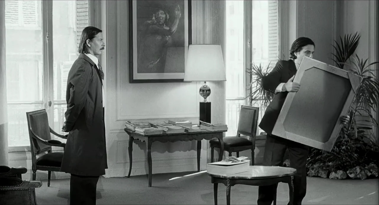 The Bohemian Life (1945) movie still: fullbody — A well-lit room features traditional French windows, a console table, and a large framed painting.…