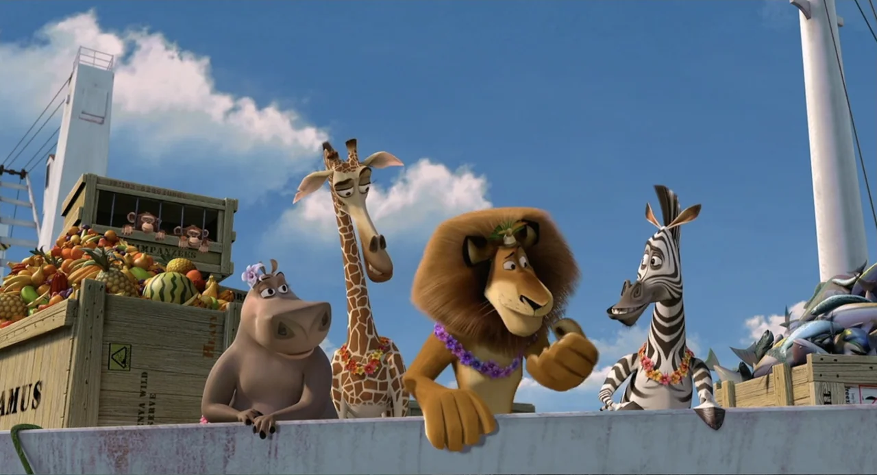 Madagascar (2005) movie still: medium — A group of zoo animals stand behind a railing on a wooden ship deck. They observe a small object in the…