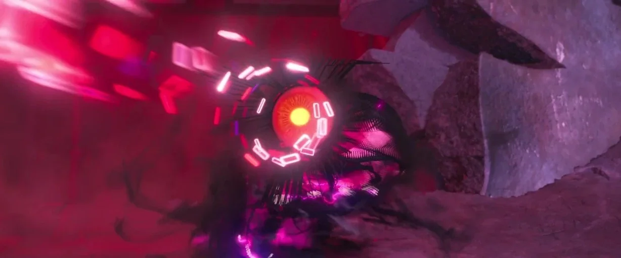 Ralph Breaks the Internet (2018) movie still: closeup — A dark, fractured space contains a mechanical device with a glowing yellow circular core.…