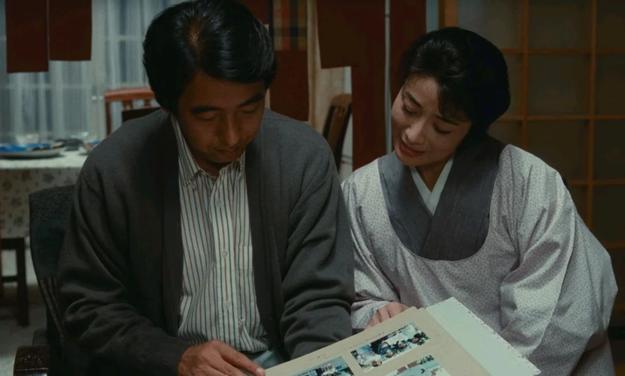 Chizuko’s Younger Sister (1991) movie still: medium — A Japanese home interior features sliding paper doors and a wooden dining table setting. A…
