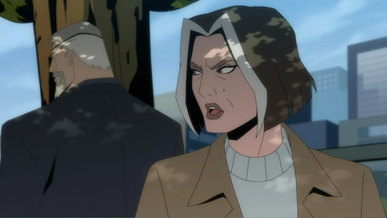 Deathstroke: Knights & Dragons - The Movie (2020) movie still: medium — A woman stands in a city park with a man positioned behind her. She speaks…