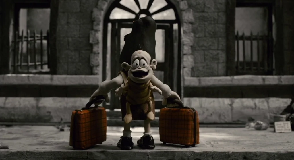 Mary & Max (2009) movie still: fullbody — A claymation character stands before a weathered stone wall with arched doorways. The figure holds two…