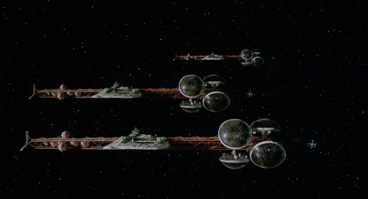 Silent Running (1972) movie still: wide — Three large industrial spacecraft with spherical modules travel through a star-filled void. The ships…