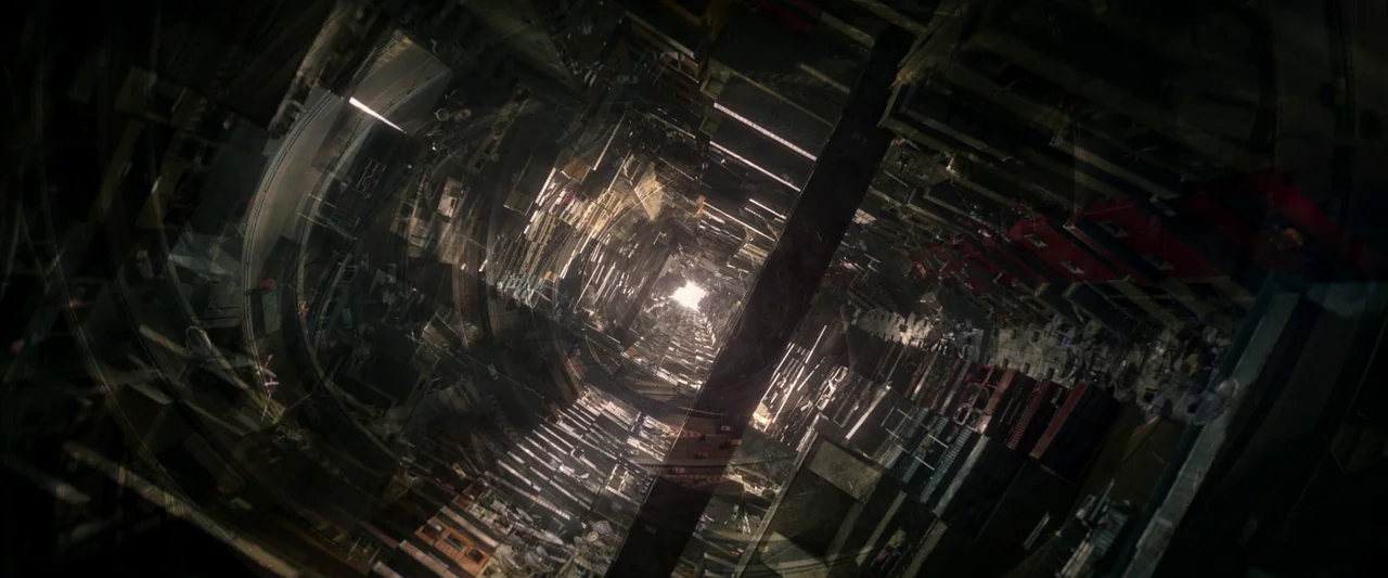 Three Thousand Years of Longing (2022) movie still: establishing — An urban canyon formed by tightly packed high-rise buildings and intersecting…