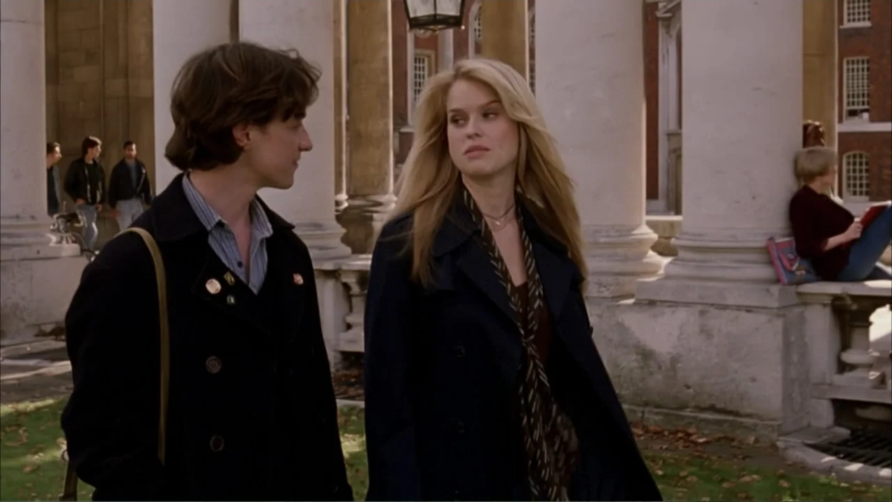 Starter for 10 (2006) movie still: medium — A stone-columned courtyard with traditional academic architecture in the background. A young man and…