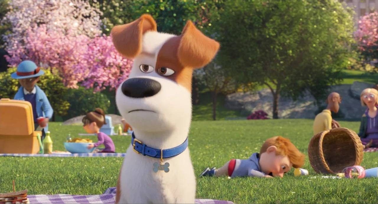 The Secret Life of Pets 2 (2019) movie still: medium — A sunny public park features picnic blankets on grass with flowering trees in background. A…