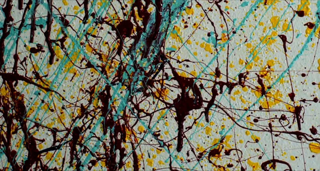 I Killed My Mother (J’ai tué ma mère) (2009) movie still: closeup — An abstract painting features chaotic drips of dark brown, bright yellow, and…