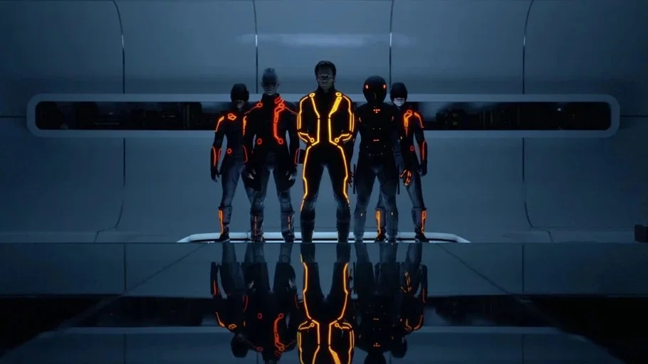 TRON: Legacy (2010) movie still: fullbody — A minimalist, sterile white room with a reflective floor and a long horizontal shelf. Five figures in…